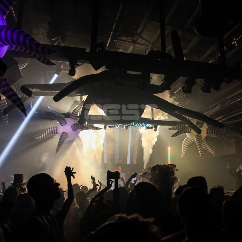 Hanging inflatable spider with LED lights for outdoor parade performance.